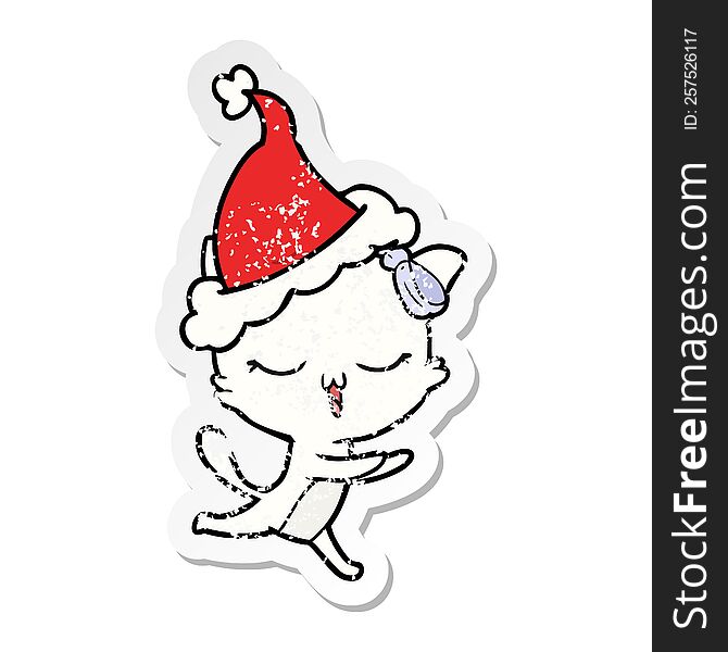 Distressed Sticker Cartoon Of A Cat With Bow On Head Wearing Santa Hat