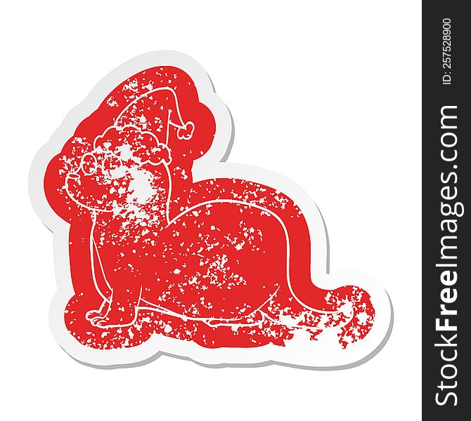 quirky cartoon distressed sticker of a otter wearing santa hat