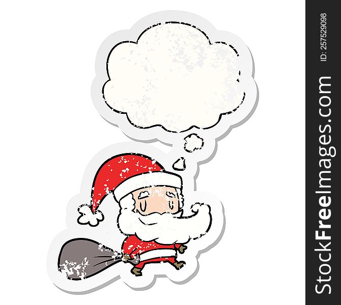 cartoon santa claus with sack and thought bubble as a distressed worn sticker