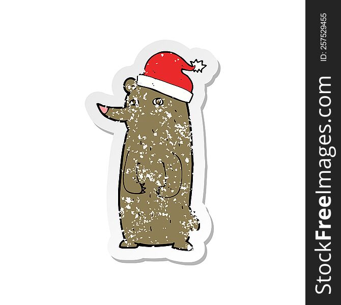 Retro Distressed Sticker Of A Cartoon Bear In Xmas Hat