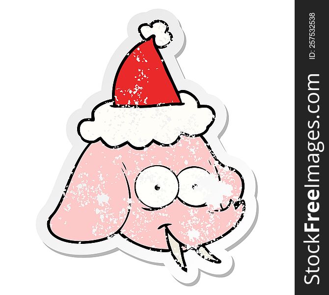 Distressed Sticker Cartoon Of A Elephant Face Wearing Santa Hat