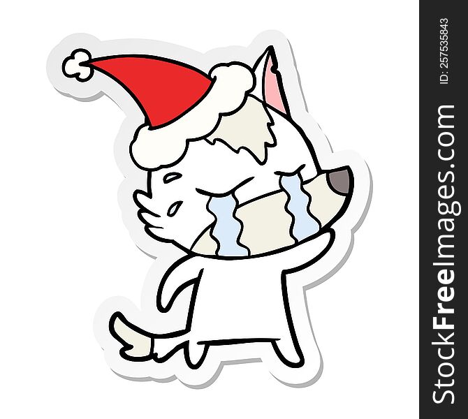 Sticker Cartoon Of A Crying Wolf Wearing Santa Hat