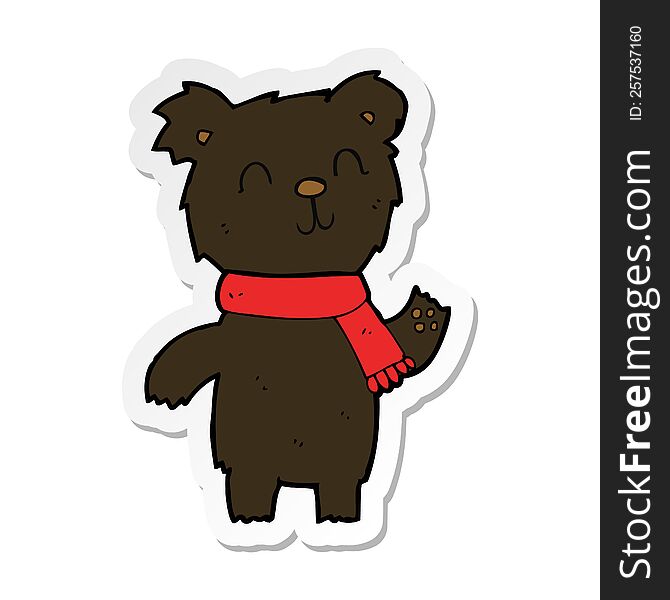 sticker of a cartoon cute black bear cub