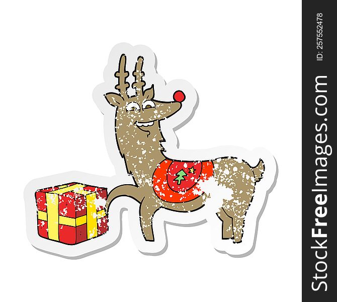 retro distressed sticker of a cartoon christmas reindeer with present