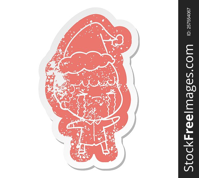 Cartoon Distressed Sticker Of A Man Crying Wearing Santa Hat