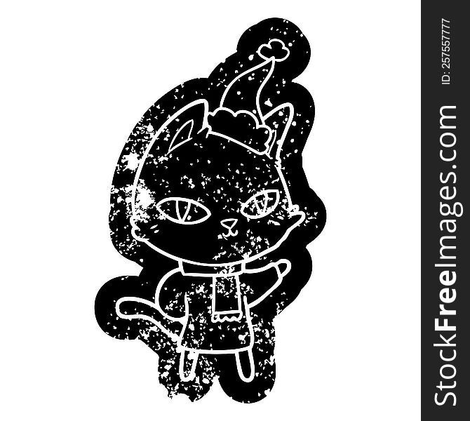 quirky cartoon distressed icon of a cat staring wearing santa hat