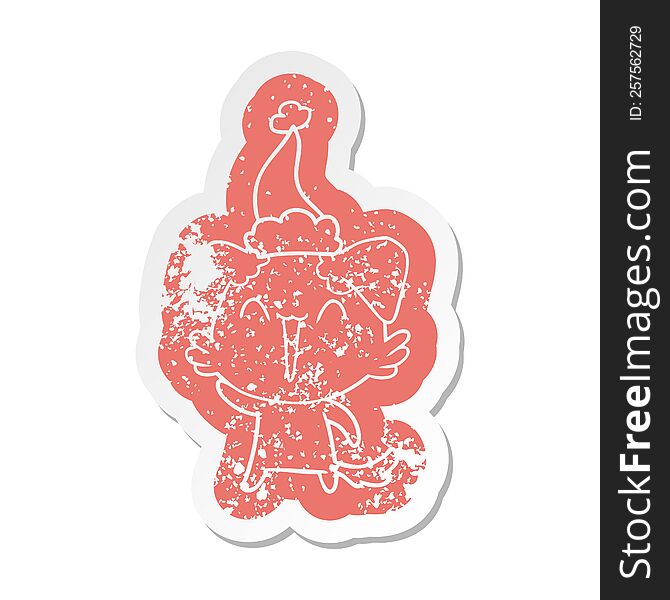 waving little dog quirky cartoon distressed sticker of a wearing santa hat