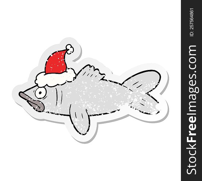 hand drawn distressed sticker cartoon of a fish wearing santa hat
