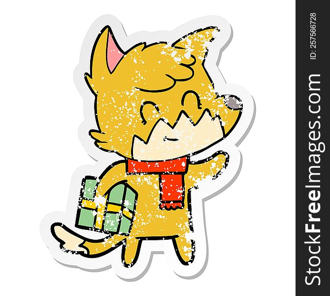 Distressed Sticker Of A Cartoon Happy Fox With Gift