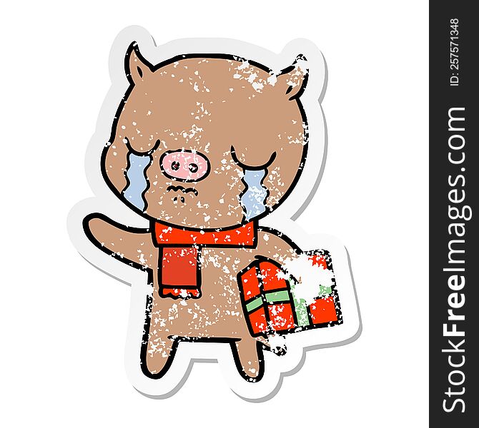 Distressed Sticker Of A Cartoon Pig Crying Over Christmas Present