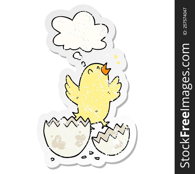 cartoon bird hatching from egg with thought bubble as a distressed worn sticker