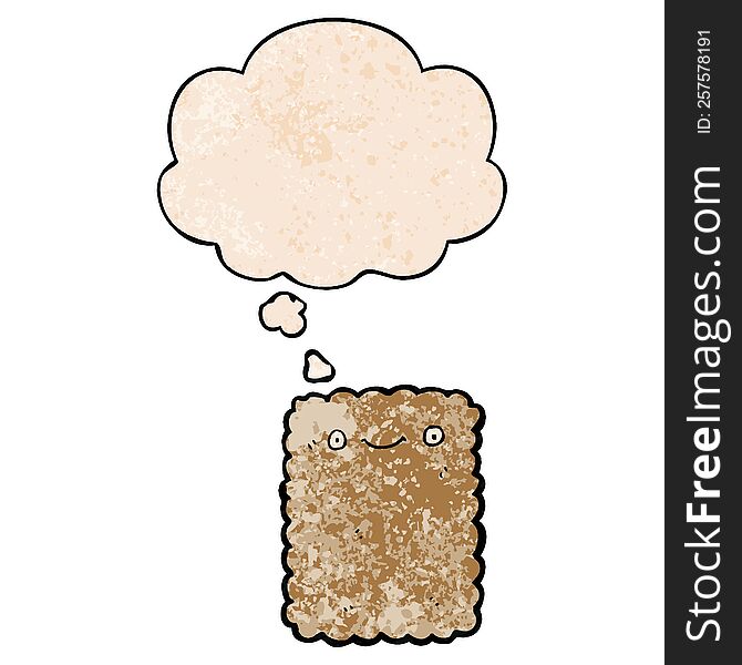 cartoon biscuit with thought bubble in grunge texture style. cartoon biscuit with thought bubble in grunge texture style