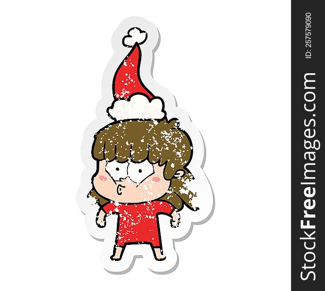 hand drawn distressed sticker cartoon of a whistling girl wearing santa hat