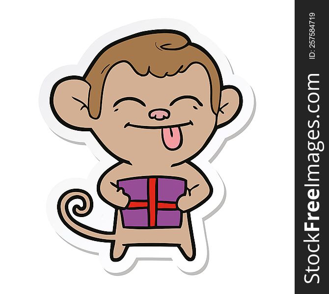 sticker of a funny cartoon monkey with christmas present