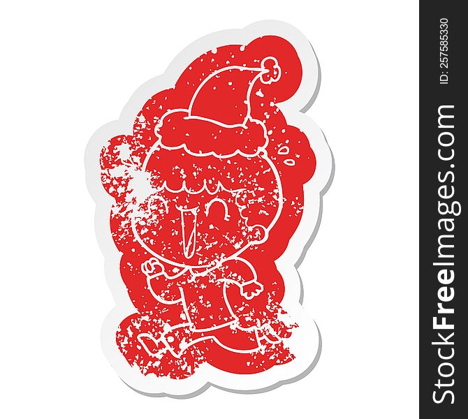 Laughing Cartoon Distressed Sticker Of A Man Wearing Santa Hat