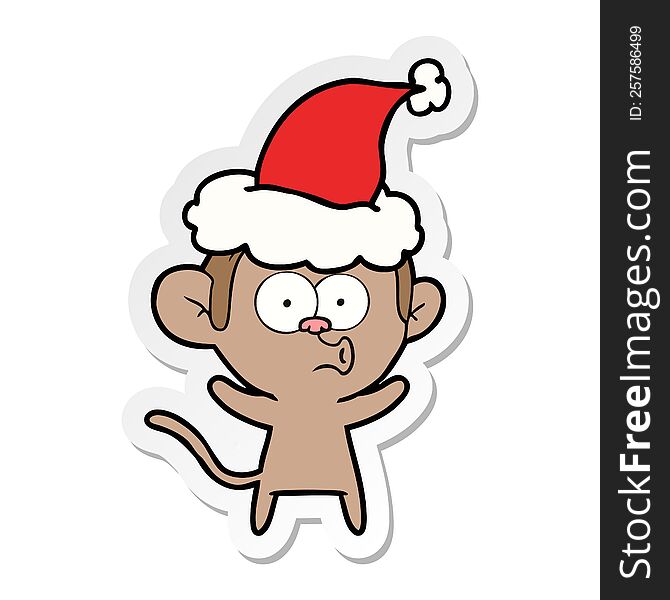 hand drawn sticker cartoon of a surprised monkey wearing santa hat
