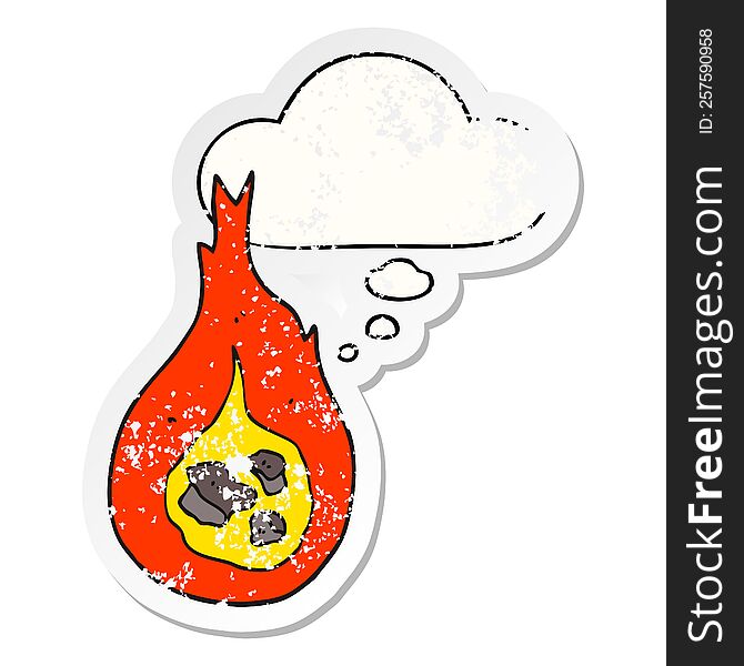 cartoon fireball and thought bubble as a distressed worn sticker