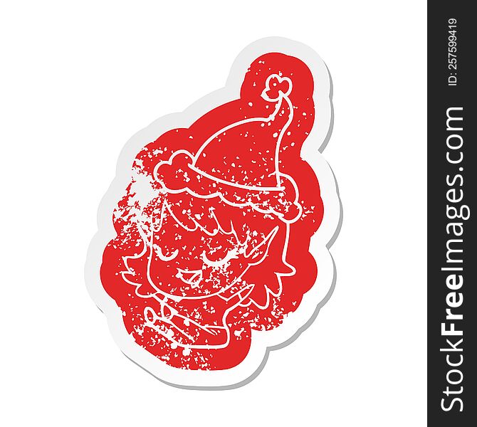 happy quirky cartoon distressed sticker of a elf girl sitting wearing santa hat