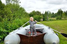 Free Boy  Rowing A Boat Royalty Free Stock Image - 25767266