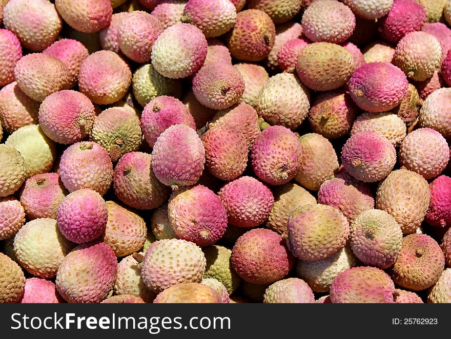Freshly cut fruits lychee as an agricultural background