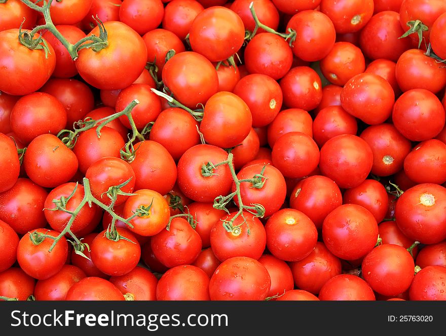 Red tomato as an agricultural background. Red tomato as an agricultural background