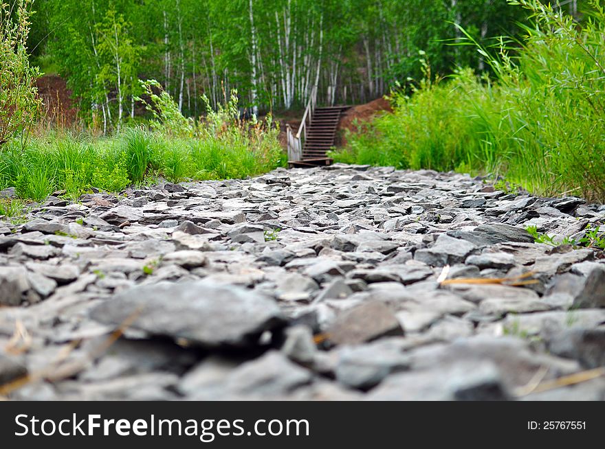 Road from a stone. wood ladder in ahead. Road from a stone. wood ladder in ahead