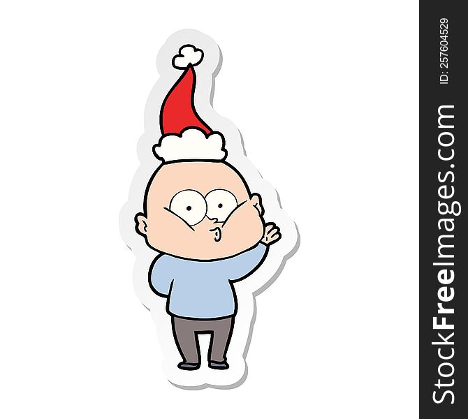 sticker cartoon of a bald man staring wearing santa hat