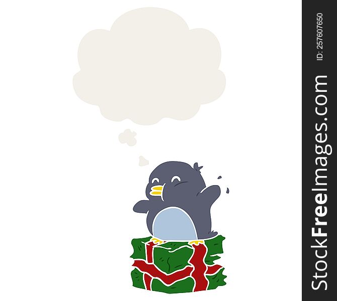 cartoon penguin on present with thought bubble in retro style