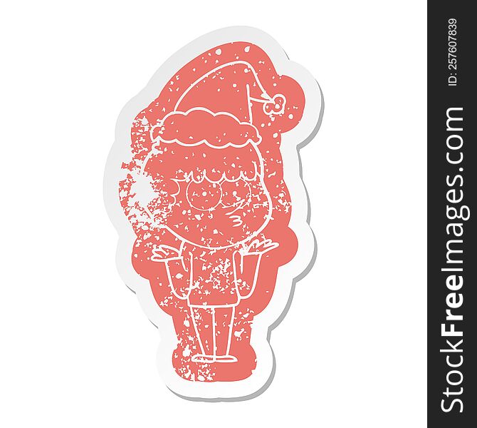 quirky cartoon distressed sticker of a curious boy shrugging shoulders wearing santa hat