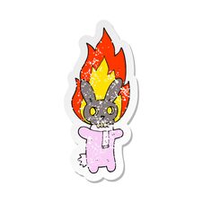 Retro Distressed Sticker Of A Cartoon Flaming Skull Rabbit Stock Image