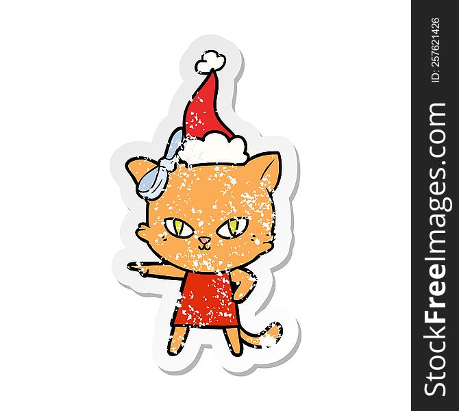cute hand drawn distressed sticker cartoon of a cat wearing dress wearing santa hat