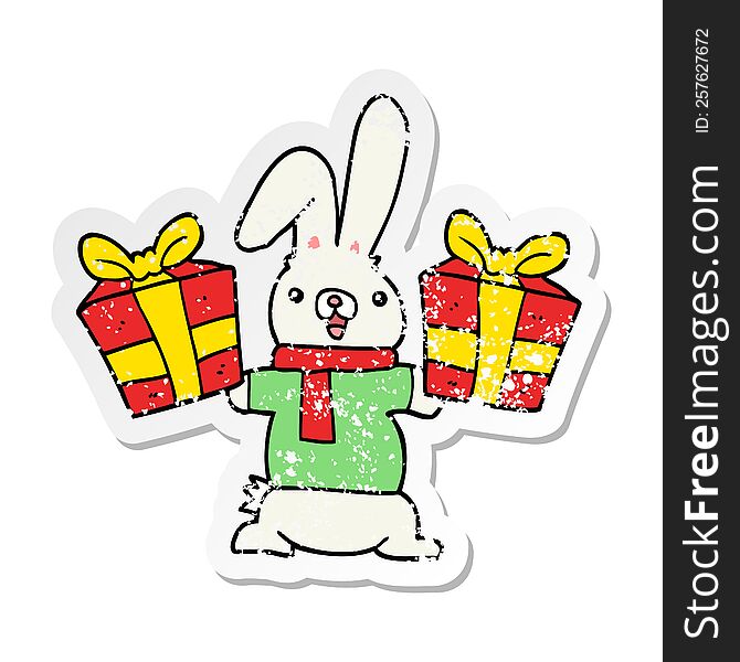 distressed sticker of a cartoon rabbit with christmas presents