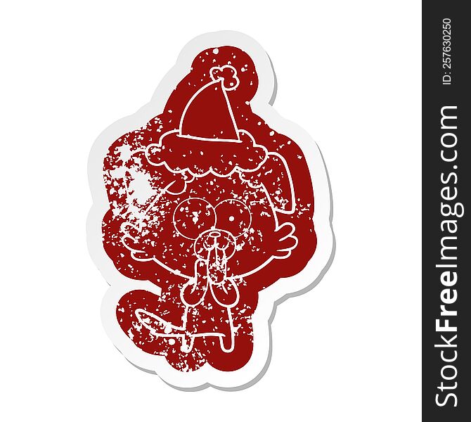 quirky cartoon distressed sticker of a dog with tongue sticking out wearing santa hat