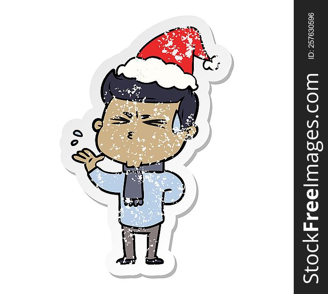 Distressed Sticker Cartoon Of A Man Sweating Wearing Santa Hat
