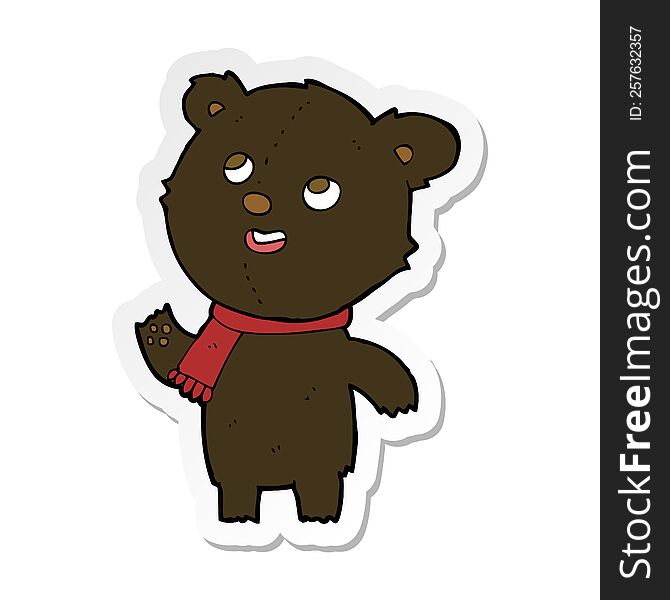 sticker of a cartoon black bear wearing scarf