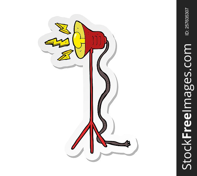 sticker of a cartoon studio lamp shining