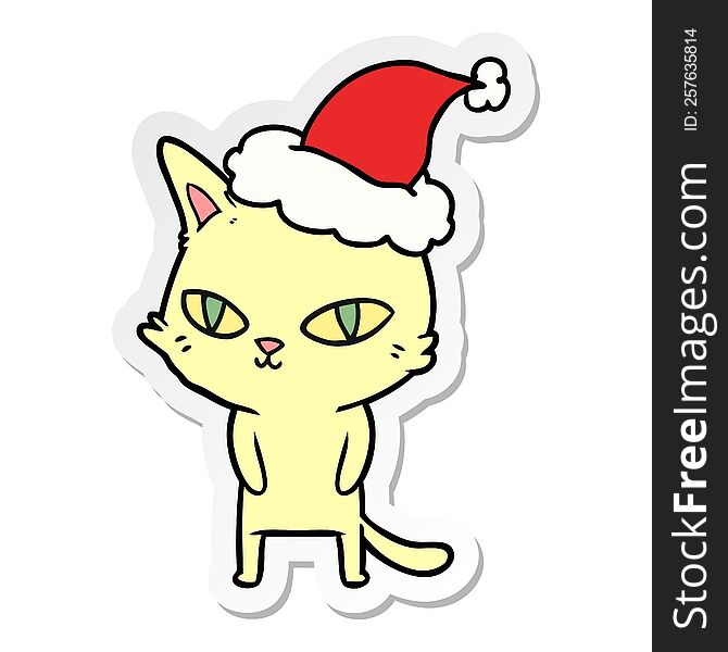 sticker cartoon of a cat with bright eyes wearing santa hat