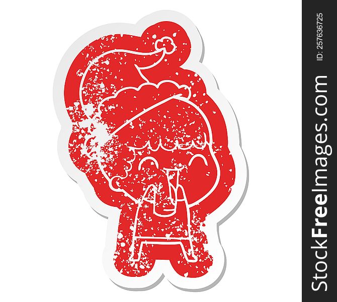 Cartoon Distressed Sticker Of A Happy Man Wearing Santa Hat