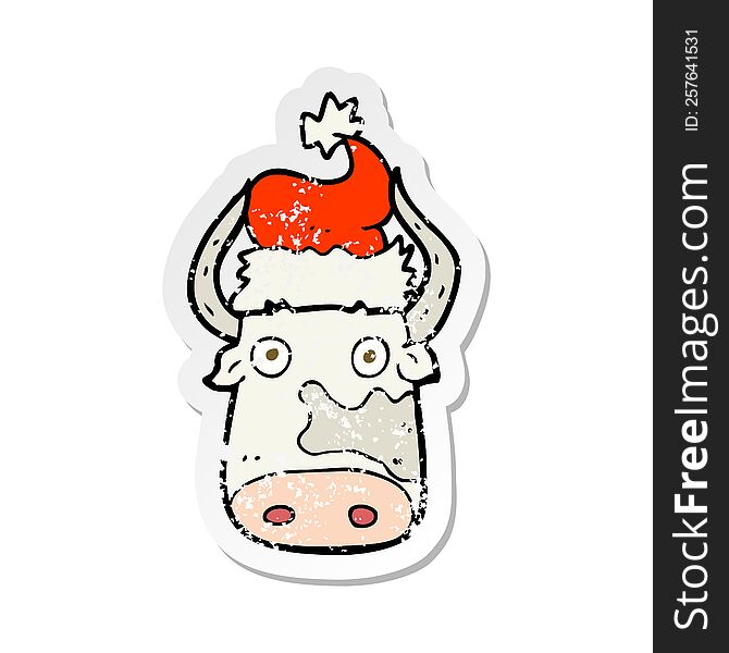 retro distressed sticker of a cartoon cow wearing christmas hat