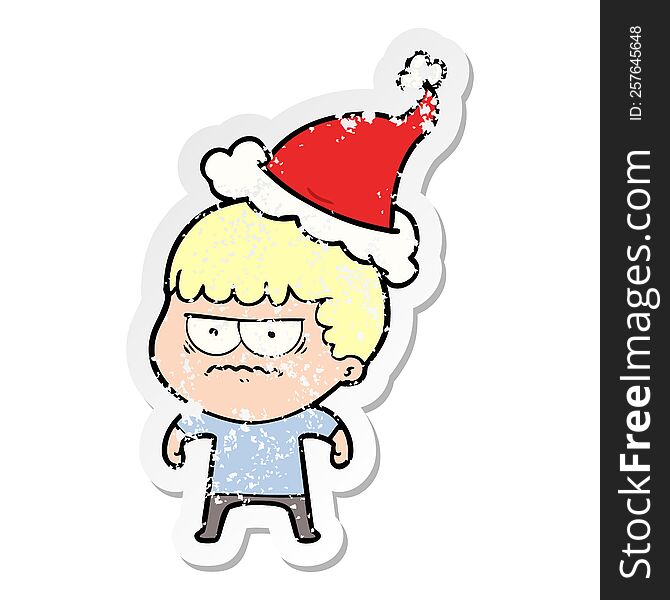 Distressed Sticker Cartoon Of A Annoyed Man Wearing Santa Hat