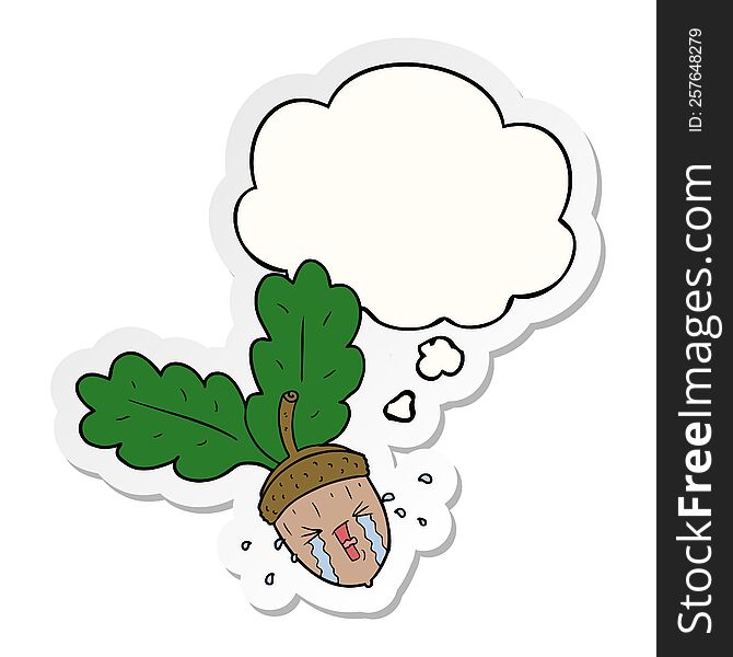 cartoon crying acorn with thought bubble as a printed sticker