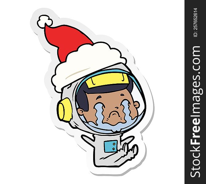 Sticker Cartoon Of A Crying Astronaut Wearing Santa Hat