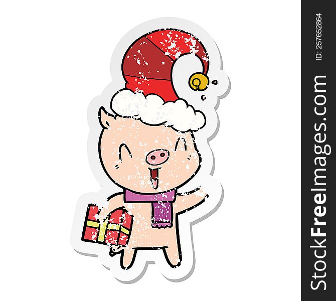 distressed sticker of a happy cartoon pig with xmas present