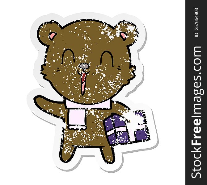 Distressed Sticker Of A Happy Cartoon Bear With Gift