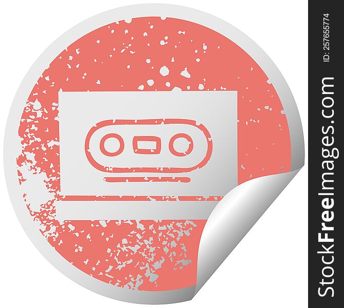 distressed circular peeling sticker symbol of a retro cassette