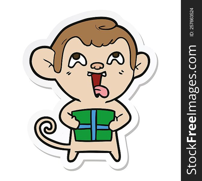 sticker of a crazy cartoon monkey with christmas present