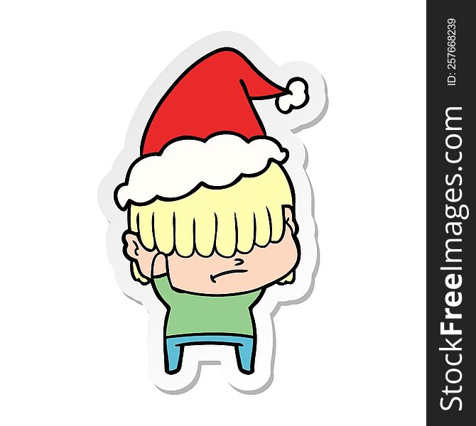 hand drawn sticker cartoon of a boy with untidy hair wearing santa hat