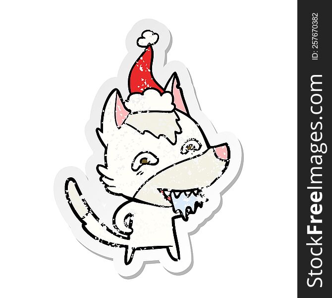 Distressed Sticker Cartoon Of A Hungry Wolf Wearing Santa Hat