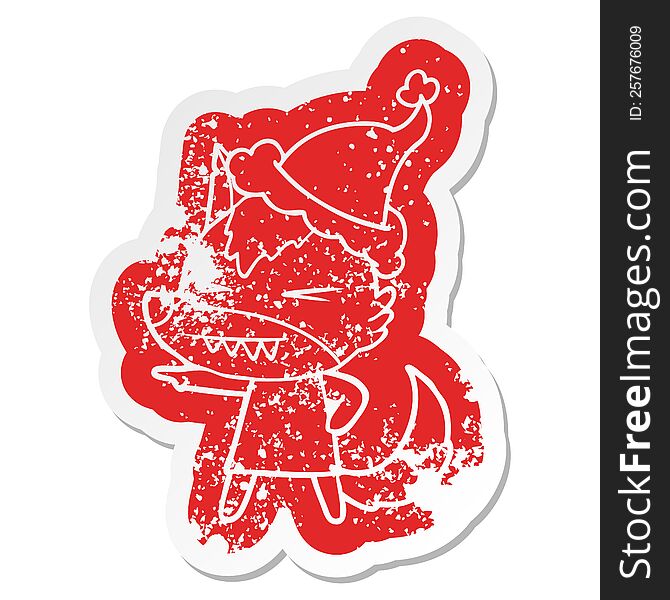 Angry Wolf Cartoon Distressed Sticker Of A Wearing Santa Hat