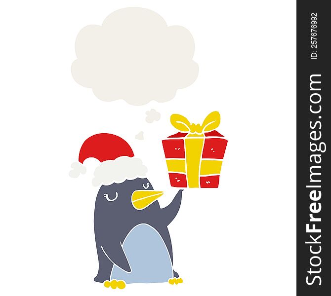 cartoon penguin with christmas present with thought bubble in retro style